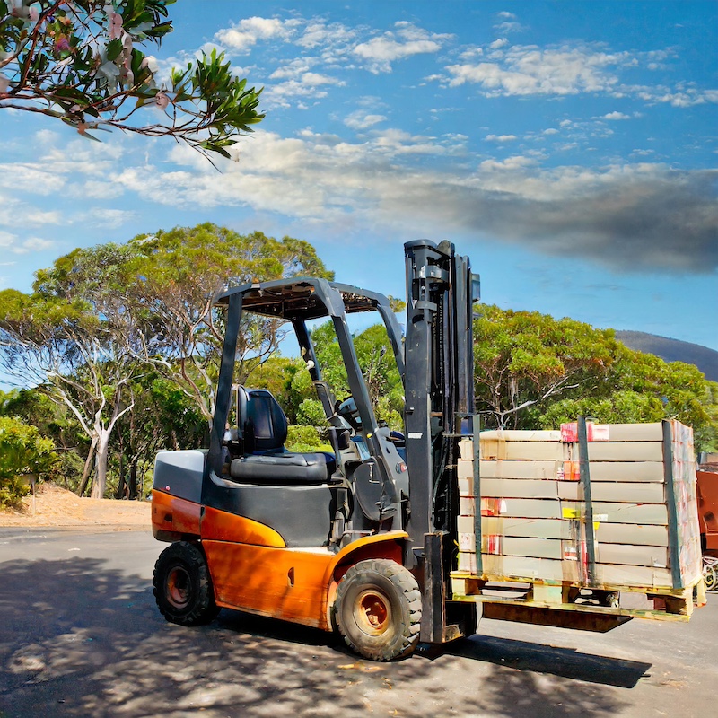 A forklift carrying cargo, in Austrailia